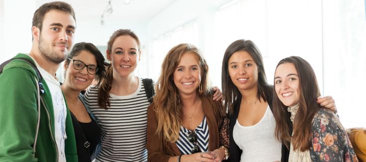 photo of six young people smiling to the camera